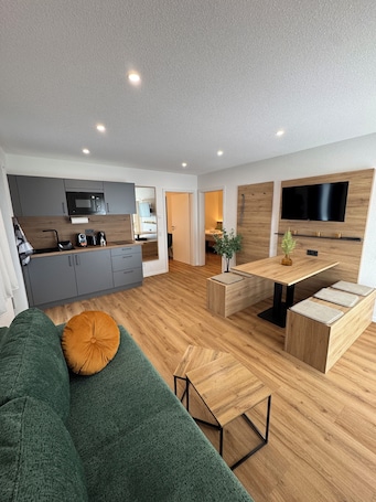 Apartment 19, 2 bedrooms, balcony | Living area | 40-inch Smart TV with satellite channels, heated floors