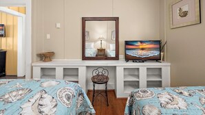 A bedroom with two beds, a television, a mirror, and a desk. - Mallard 2A close to the Beach (Ocean City)