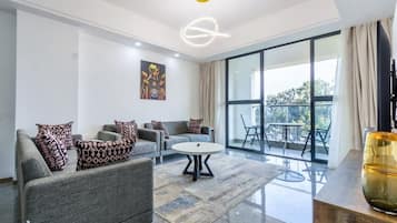 Family Apartment, Balcony, City View | Living area | Smart TV