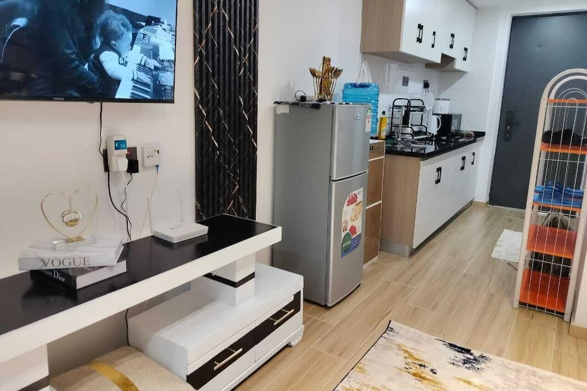 Classic Studio Suite, Balcony, City View | Living area | Smart TV