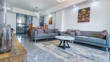 Family Apartment, Balcony, City View | Living area | Smart TV