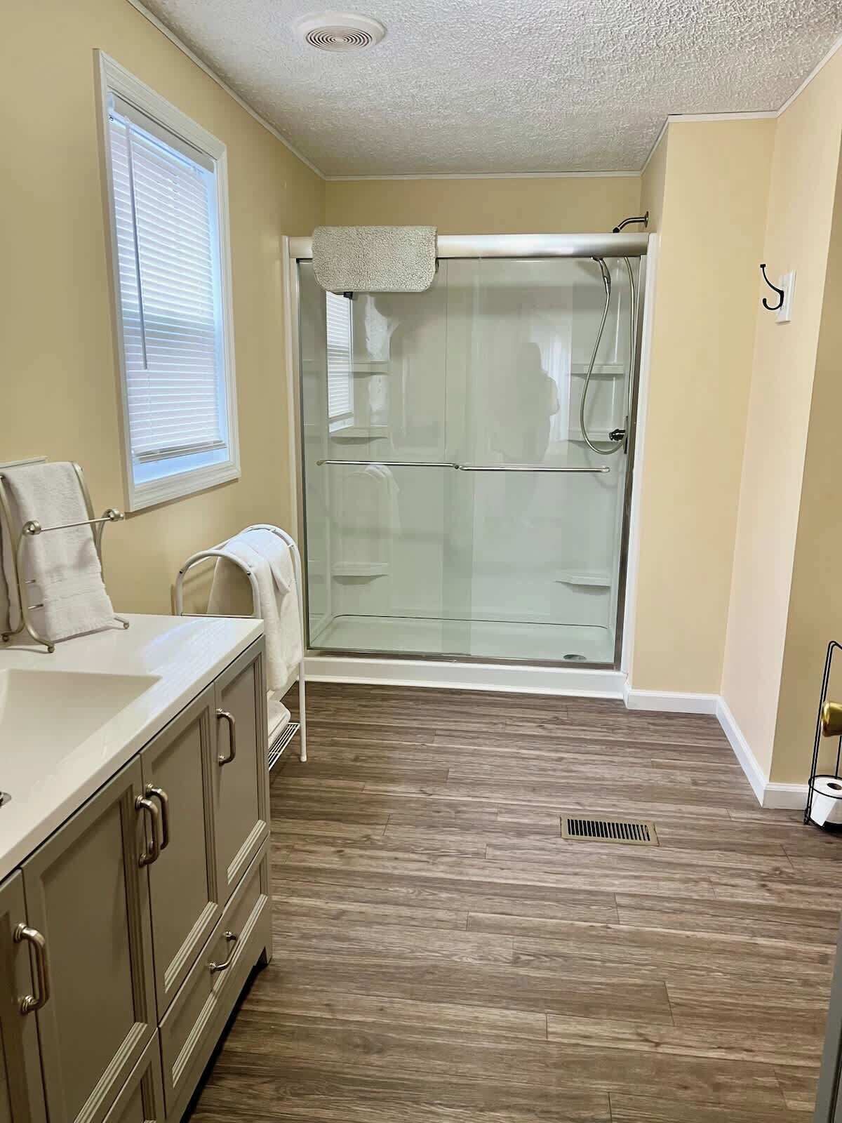 Shower, towels, soap, toilet paper
