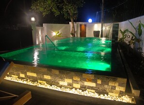 A rectangular swimming pool with a tiled edge and a pebble-lined bottom. - Sea Bloom Villa (Thalaramba)