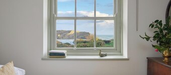 A charming traditional coastguard cottage offering breathtaking views of Lulworth Cove and the surrounding countryside. This spacious retreat, perfect for a relaxing getaway. Sleeps eight people across four spacious bedrooms.