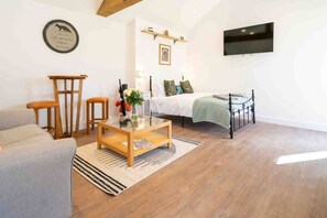 Travel crib, free WiFi, bed sheets - The Den: riverside bolthole (Baston, Stamford)