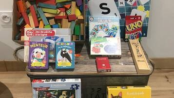 A variety of children's board games and puzzles on display.