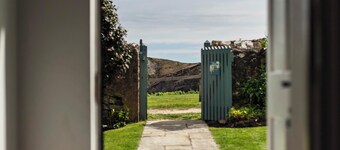 A beautifully appointed traditional coastguard cottage featuring a private garden and stunning views of Lulworth Cove in Dorset. Sleeps up to five people in three bedrooms.