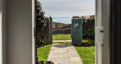 A beautifully appointed traditional coastguard cottage featuring a private garden and stunning views of Lulworth Cove in Dorset. Sleeps up to five people in three bedrooms.
