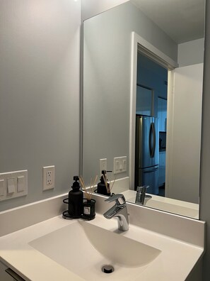 Bathtub, hair dryer, towels, soap