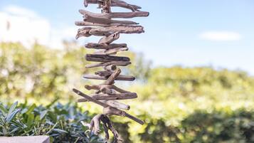 A vertical arrangement of wooden branches.