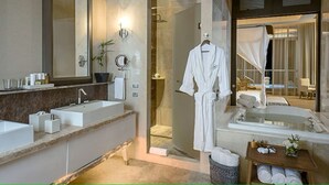 A modern bathroom with a large mirror, two sinks, a bathtub, and a shower area. - GRAND LUXXE - THE RESIDENCE FOUR BEDROOM TOWER (Las Jarretaderas)
