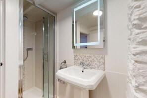 Shower, hair dryer, towels, toilet paper