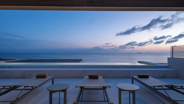 A rooftop terrace with a pool, lounge chairs, and tables, overlooking the sea. - Patamar Luxury Condo - Includes Chef, Maid & Premier Access (Punta Mita)