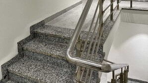 A staircase with metal railings and granite steps. - HOTEL MANGALAM REGENCY (Indore)