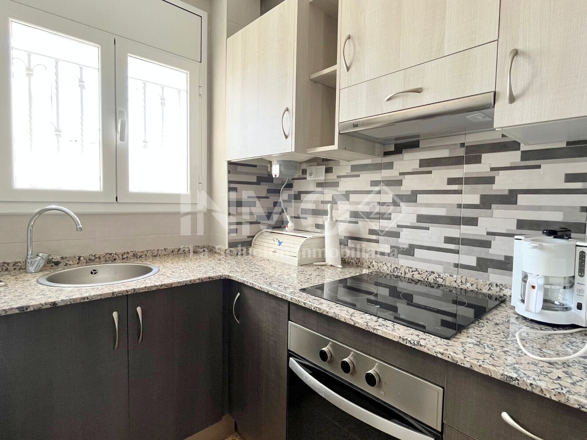 Fridge, microwave, coffee/tea maker, cookware/dishes/utensils