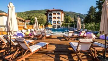 Outdoor pool, pool umbrellas, pool loungers