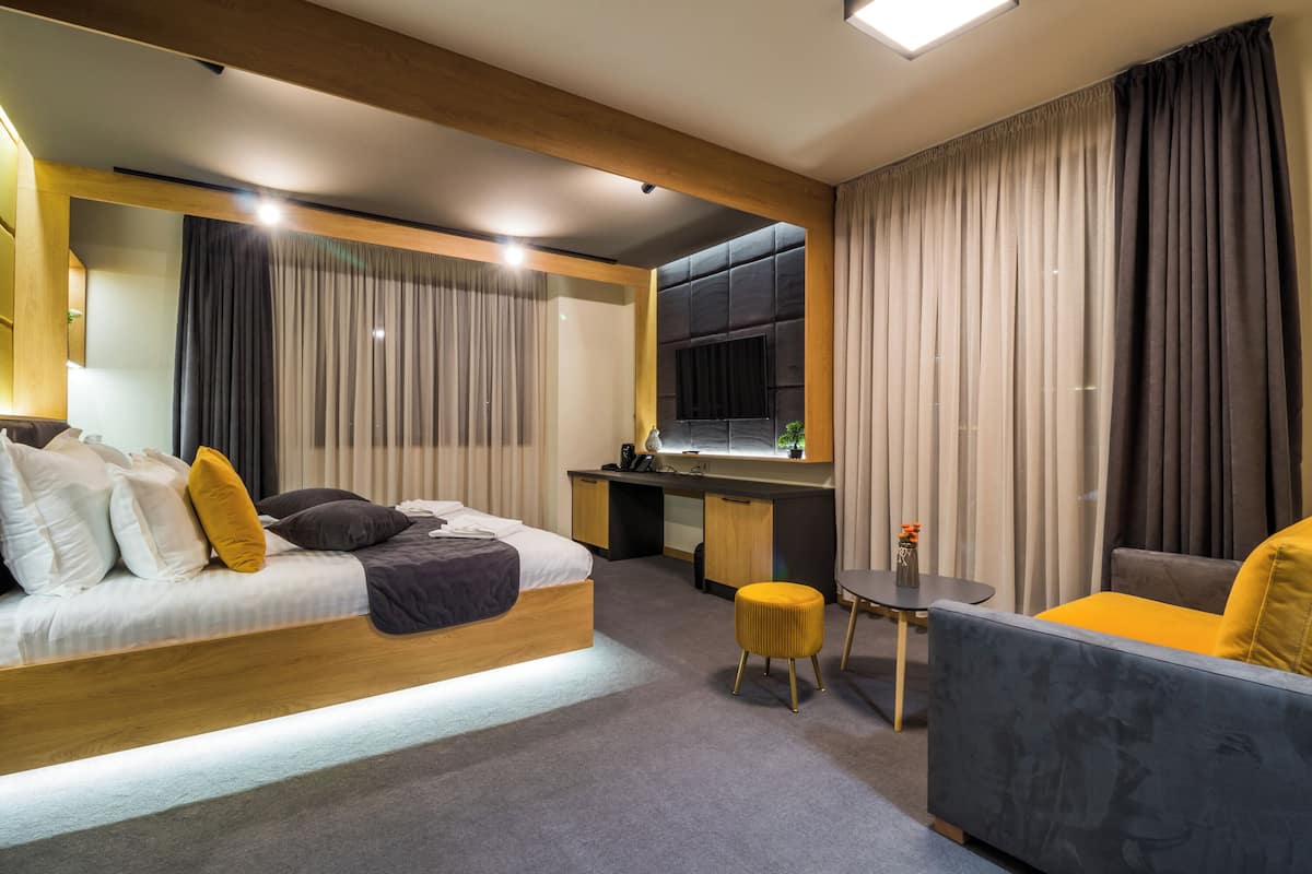 Deluxe Double Room, Balcony | In-room safe, desk, laptop workspace, blackout drapes