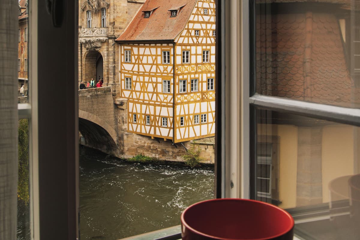 Deluxe Suite, River View | In-room safe, desk, laptop workspace, blackout drapes