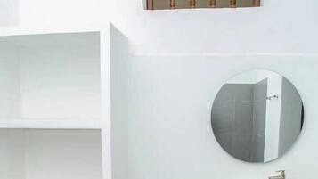 Shower, towels, soap, toilet paper