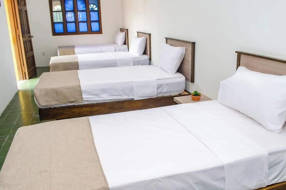 Deluxe Quadruple Room, Courtyard View | Desk, free WiFi