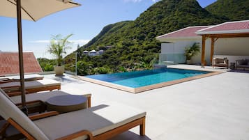 Outdoor pool, pool umbrellas, sun loungers