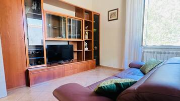 Deluxe kamer, uitzicht op tuin | Woonruimte