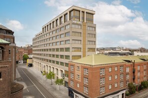 A multi-story building with a sign reading 'HOME2'. - Home2 Suites By Hilton Dublin City Centre (Dublin)