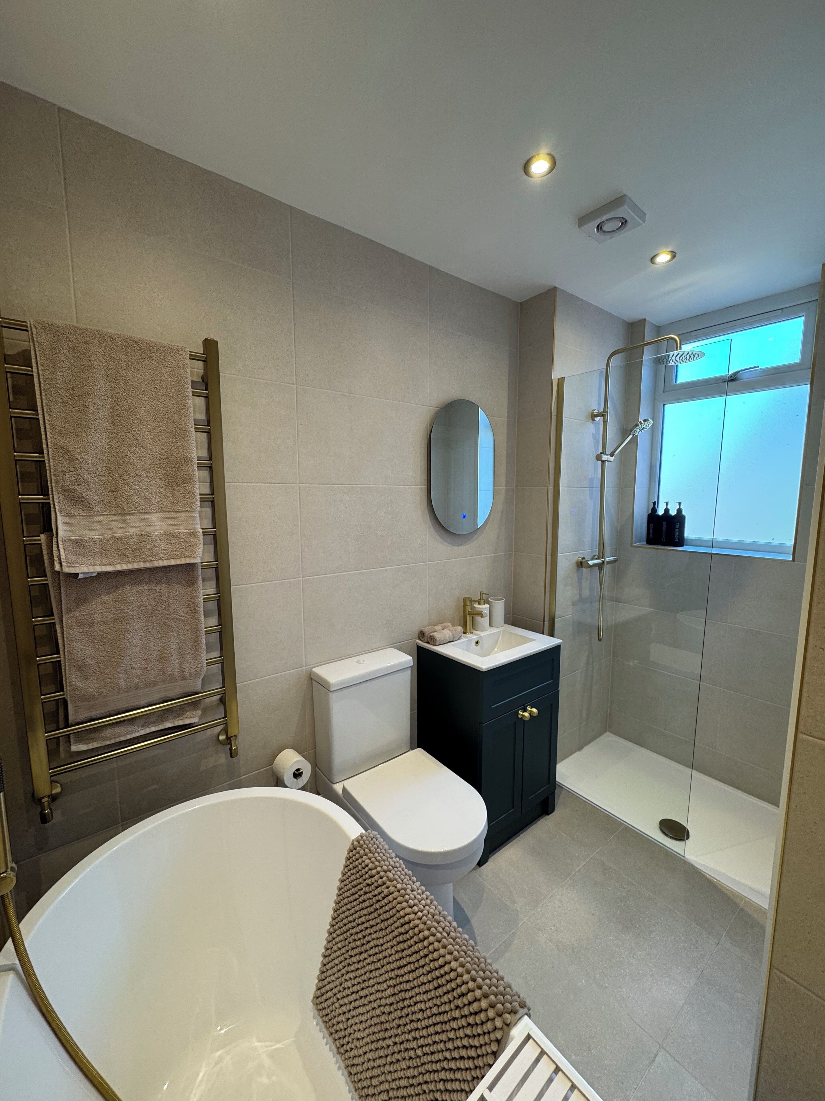 Shower, hair dryer, towels, soap