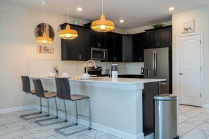 Fridge, microwave, oven, stovetop - ChampionsGate Resort 8BR Home w/ Pool, Hot Tub, Theater, Game Room  & Much More! (Kissimmee)