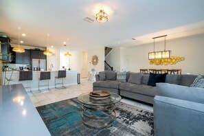 TV, books - ChampionsGate Resort 8BR Home w/ Pool, Hot Tub, Theater, Game Room  & Much More! (Kissimmee)