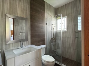 Shower, towels, soap, toilet paper