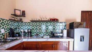 Fridge, microwave, stovetop, coffee/tea maker