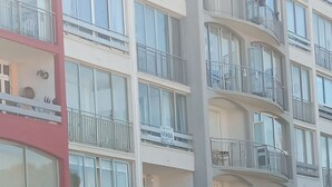 A multi-story residential building with balconies and large windows. - T2 apartment in residence 100 m from the beach. (Canet-en-Roussillon)