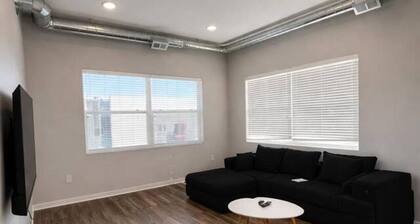 Sleek Black-and-White 2BR with Gym, WiFi & Free Parking