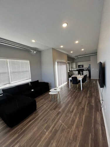 Sleek Black-and-White 2BR with Gym, WiFi & Free Parking