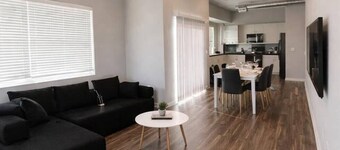 Sleek Black-and-White 2BR with Gym, WiFi & Free Parking