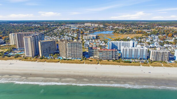 A coastal cityscape with high-rise hotels, a beach, and a river. - Surf street + Near the Beach + Pet friendly (North Myrtle Beach)