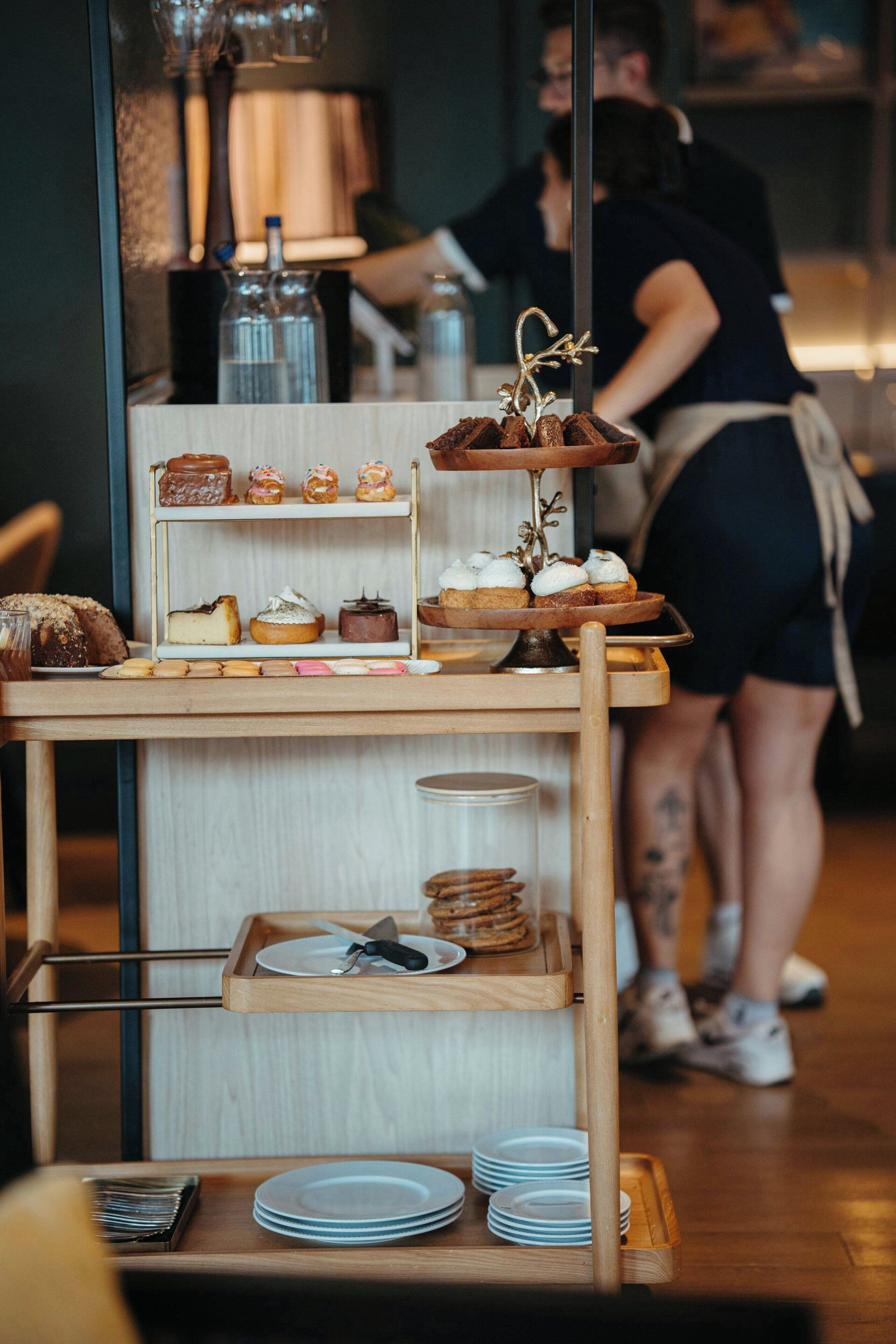 A bakery display with pastries and a coffee machine in the background.