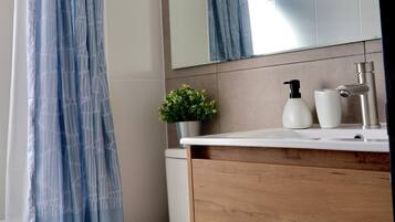 Apartment, 2 Bedrooms | Bathroom | Hair dryer, towels, soap