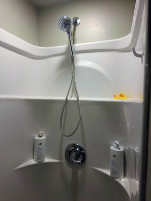 Shower, hair dryer, towels, soap