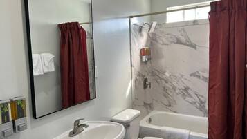 Deluxe Triple Room, Multiple Beds | Bathroom | Bathtub, hair dryer, towels