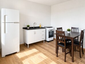 Apartamento conforto, cozinha, vista para o jardim | Opções para refeição