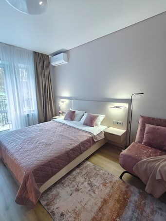 Comfort Triple Room, Balcony, Garden View | Desk, laptop workspace, blackout drapes, iron/ironing board