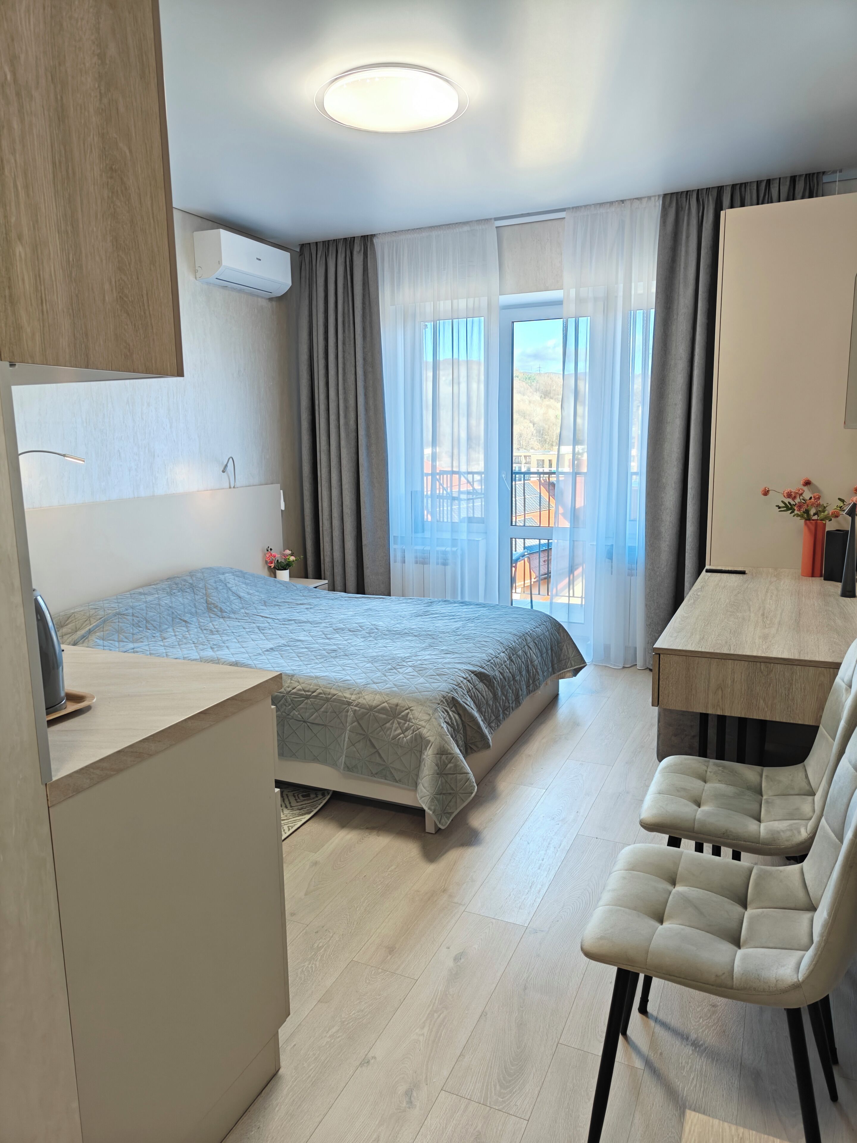 Apartment, Balcony, Mountain View | Desk, laptop workspace, blackout curtains, iron/ironing board