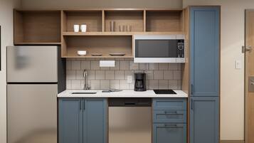 A modern kitchen with a built-in microwave, a coffee maker, and a dishwasher.