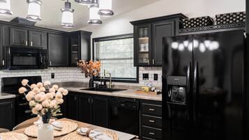 Coffee/tea maker, fridge, microwave, oven