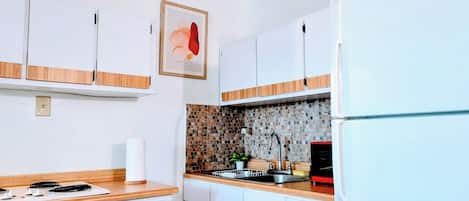 Fridge, microwave, stovetop, coffee/tea maker