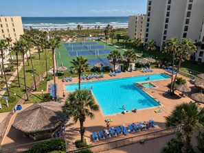 A resort with a swimming pool, sun loungers, and a view of the ocean. - Saida III Condos - S3706 (South Padre Island)