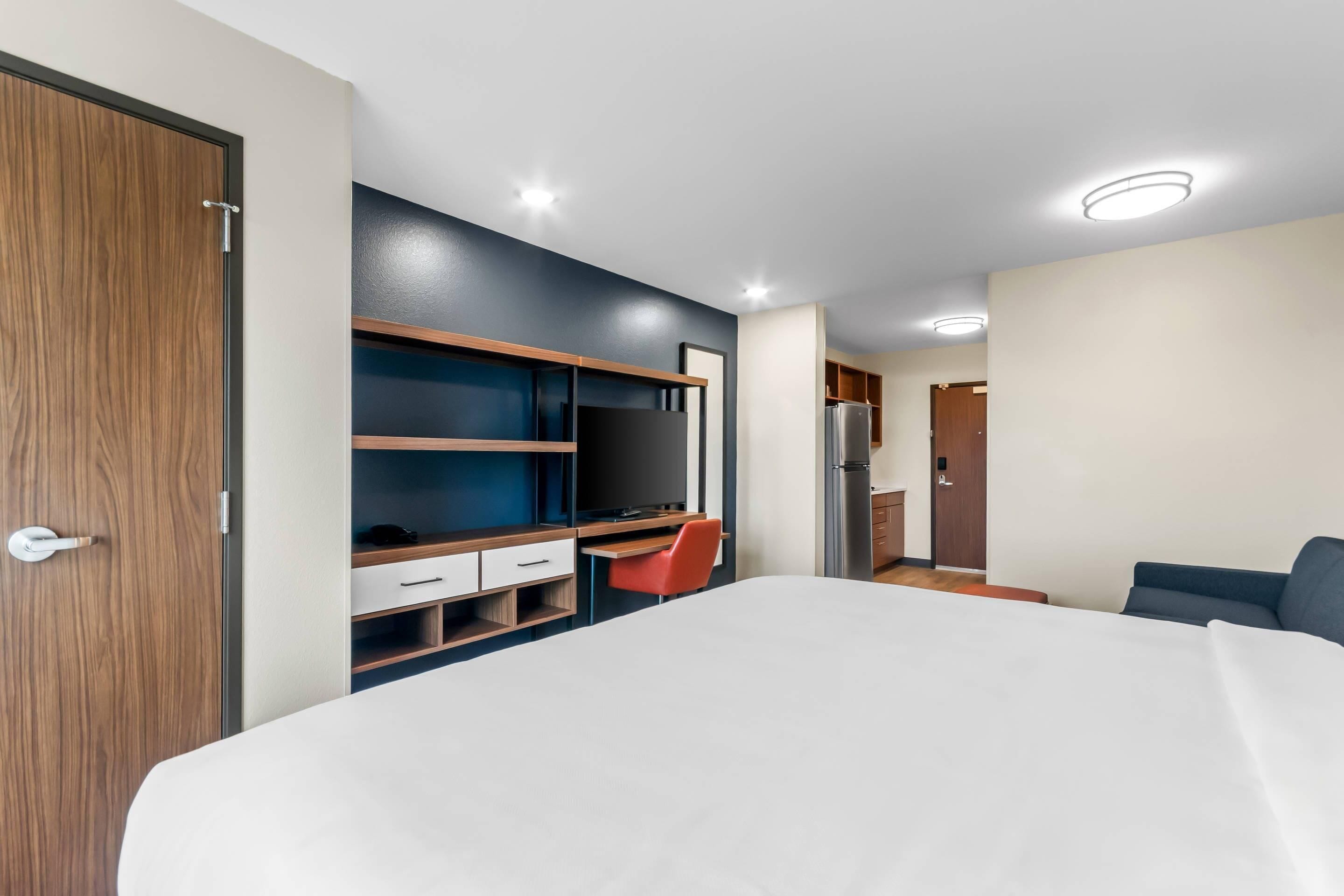 Suite, 1 King Bed, Non Smoking | Pillowtop beds, desk, laptop workspace, iron/ironing board