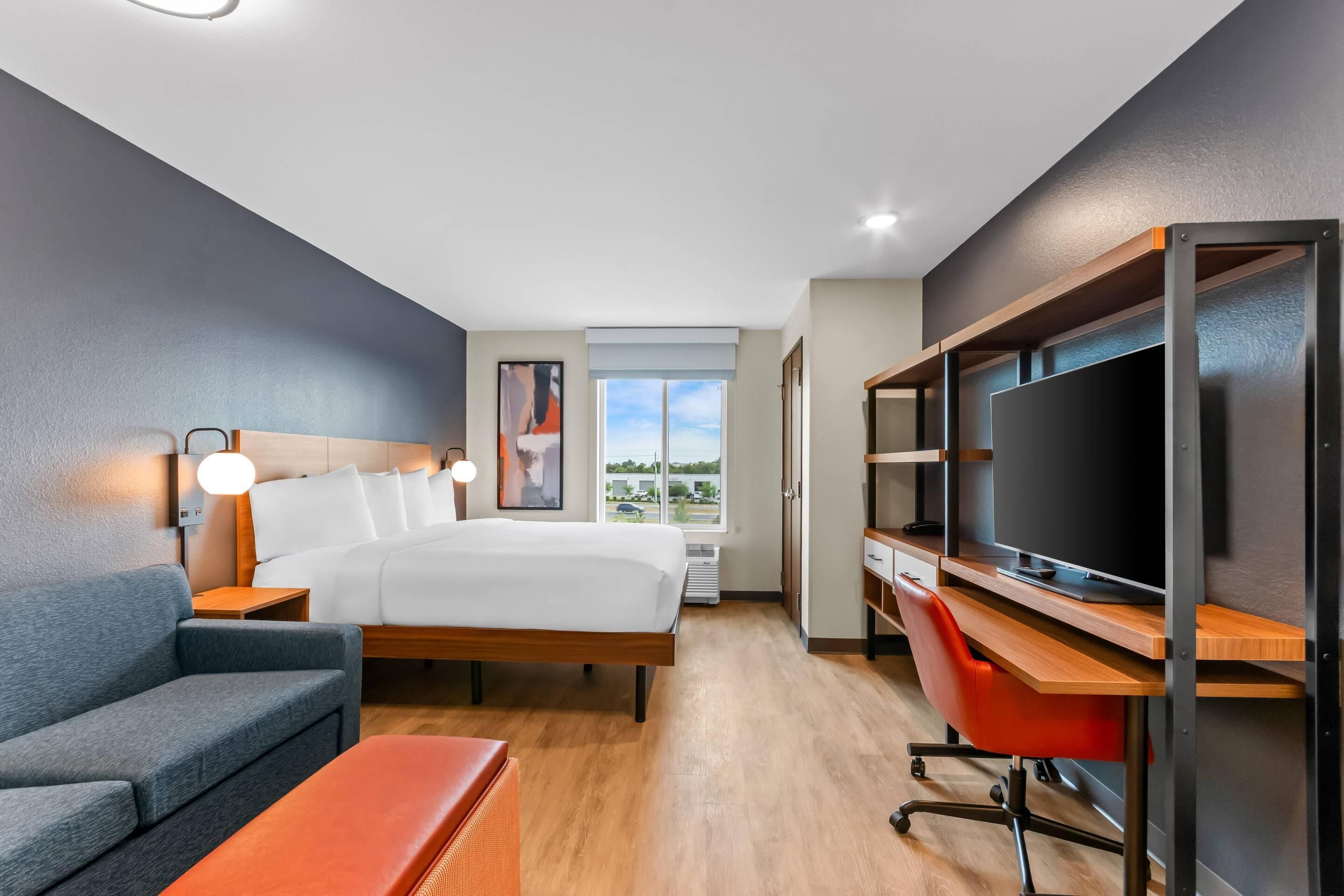Suite, 1 King Bed, Non Smoking | Pillowtop beds, desk, laptop workspace, iron/ironing board